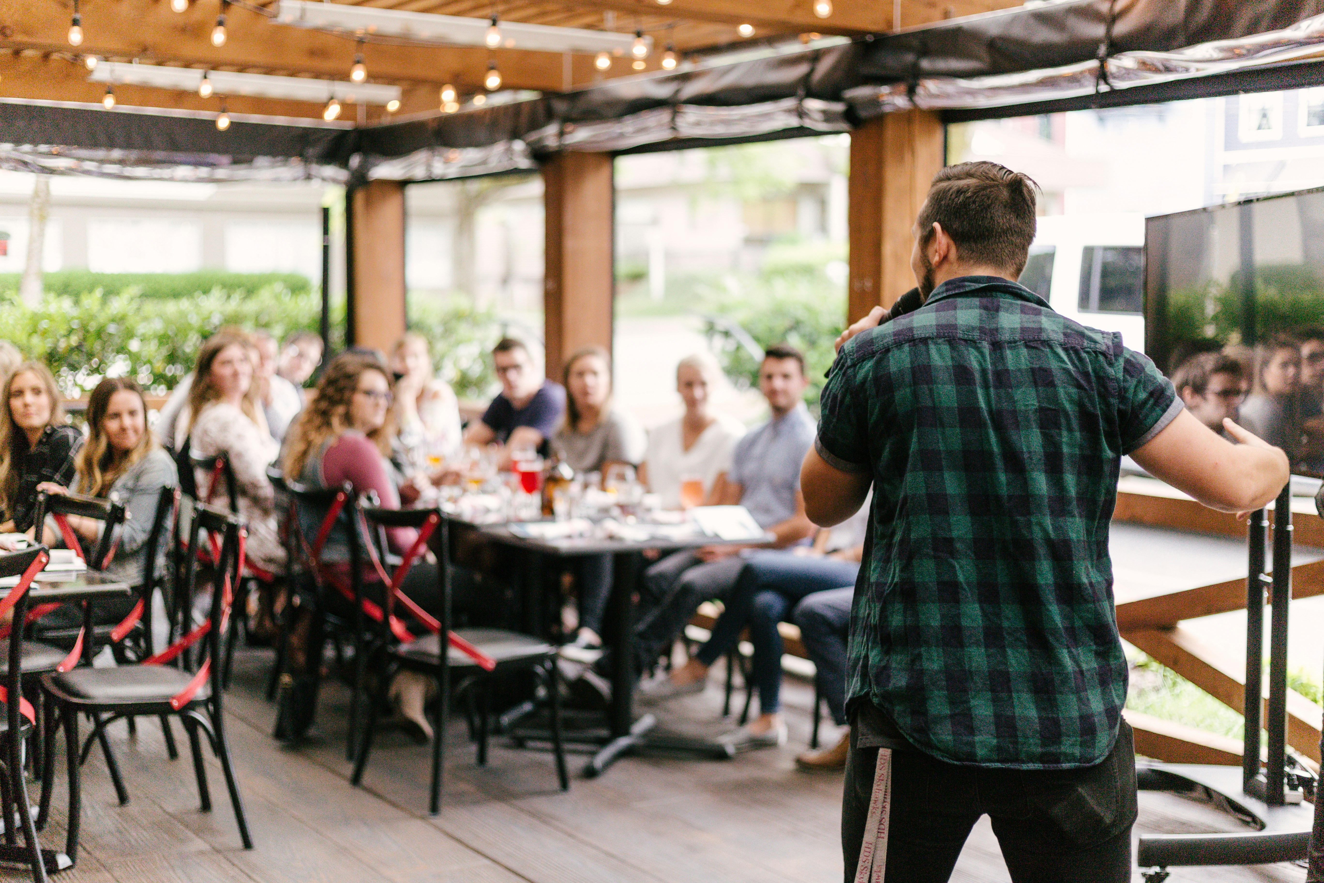 Speaker at a podium addressing an audience